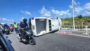 2 injured after vehicle overturns on airport road