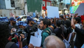 Police block march calling for release of journalists