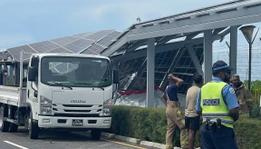 Car overturns on bridge highway, damages solar panels
